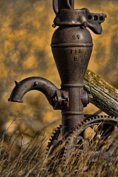 a black and white photo of an old fire hydrant