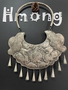 Hmong Silver Necklace,Vintage Lucky symbol Design,Sweater detective,Miao Silver ,Tribal Necklace ,Boho Style, This necklace is handmade craft by our family lived in minority area Southwest of China. It's very unique. Also can bring you much luck. The top and bottom is hmong silver carved signs.  It can be a special gift. Width: 27cm Height:29cm Weight: 30g Care Instruction:  ❥. Avoid wearing the same miao silver jewelry for a long time.Take off your jewelry before bathing or swimming. ❥. Miao silver jewelry should avoid rubbing against each other and scratch the flower surface. ❥. Use soft brush or cotton cloth to wipe the surface of jewelry, so as to remove surface stains. ❥. When not wearing, it should be sealed and packed to reduce contact with air and avoid oxidation of miao silver jew Vintage Engraved Necklace For Festival, Vintage Necklaces With Large Pendant For Festivals, Vintage Necklace With Large Pendant For Festivals, Hmong Jewelry, Bohemian Ceremonial Metal Necklace, Luxury Oxidized Amulet Necklaces, Handmade Antique Silver Amulet Necklace, Silver Jews, Hmong Necklace Silver