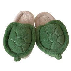 a pair of green slippers sitting on top of each other