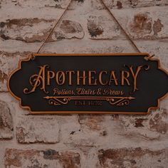 a sign that says apothecary against a white brick wall with gold lettering