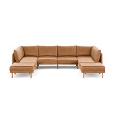 a brown leather sectional sofa with ottoman and footstool in front of a white background