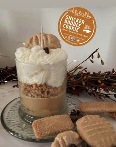 a dessert in a jar with cookies on the side