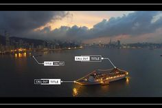 an aerial view of a cruise ship in the water at night with lights on it