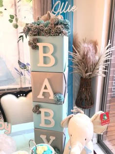 a baby shower centerpiece sitting on top of a table