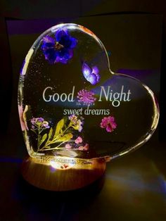 a heart shaped glass plaque with flowers on it that says, good night sweet dreams