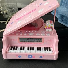 a hello kitty musical toy with an electronic keyboard