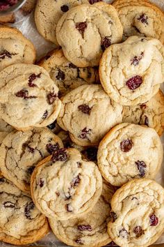 a pile of cookies sitting on top of a pan filled with cranberry toppings