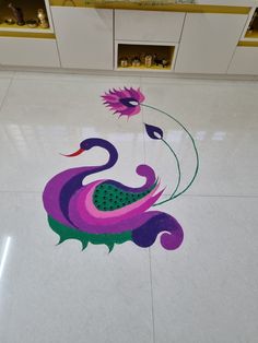 the floor is decorated with an artistic peacock design in purple, green and pink colors