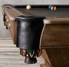 a pool table with several billiards and balls on it's back end