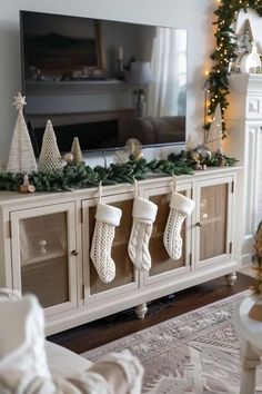 Incorporate natural materials like wood, burlap, and greenery. Use neutral tones like whites, grays, and muted greens with pops of red or gold for added cheer. Vintage-inspired ornaments, wooden reindeer, and wreaths made of twigs or pinecones bring a rustic charm.