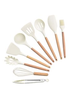 the kitchen utensils are lined up in a circle with wooden handles and spoons