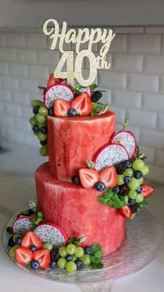 a birthday cake with fruit and the number forty