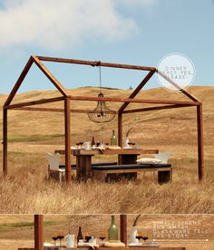 an outdoor dining area in the middle of a field