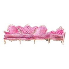 a pink couch sitting on top of a white floor next to a wooden frame with gold trim