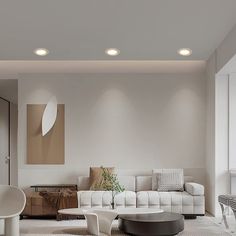 a modern living room with white furniture and accessories