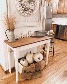 a kitchen island with some pumpkins on it