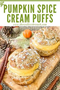 pumpkin spice cream puffs on a cutting board with cinnamon sticks