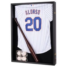 a baseball jersey and bat in a shadow box