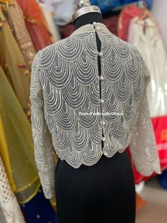 a mannequin is shown in front of some clothes