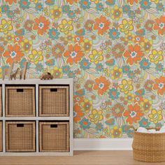 an orange and blue flowered wallpaper with wicker baskets in the foreground