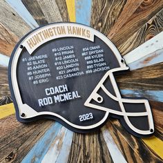 a plaque with a football helmet on it