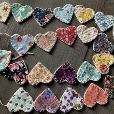 a bunch of small hearts that are on a table