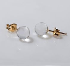 "Tiny gold stud earring, Clear lucite earring, Disco ball earring, Globe earring, Plastic post earring, Dot stud earring, Ball earrings. Gorgeous tiny clear lucite sphere earrings set in 14K gold filled cup.    So delicate tiny gold stud earrings will go just with everything. *Ball size (diameter): 6 mm/ 0.23 inch *Metal: 14K gold filled *Post: 14K gold filled backs are INCLUDED This price refers to the item in the first four pictures ONLY. The last picture illustrates variation for the current acrylic ball earrings using sterling silver post/stud with the same size of lucite ball. For more ball/globe earrings, please visit: https://www.etsy.com/shop/NAMATAjewelry?section_id=16514118&ref=shopsection_leftnav_6 HAND MADE JEWELRY All the gold filled/silver metal parts which are directly attac Tiny Gold Studs, Dot Earrings, Lucite Jewelry, Geode Earrings, Anniversary Jewelry, Gold Filled Earrings, Gold Stud, Acrylic Earrings, Hand Made Jewelry