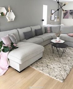 a living room filled with lots of furniture on top of a hard wood floored floor