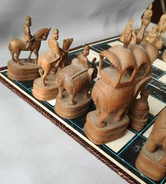 an old chess board with figurines on it