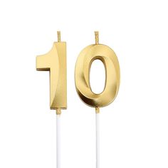 the number ten candle is gold and white