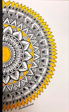 a drawing of a yellow and black design on white paper, with an orange circle in the center