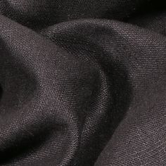 a close up view of a black fabric textured with dark grey linen material, which is very soft and smooth