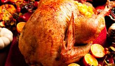 a roasted turkey with cranberries and apples