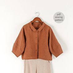 a brown shirt and beige pants hanging on a white wall with the words sewing pattern below it