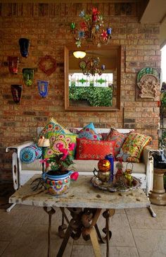 a living room filled with lots of furniture and decor on top of a wooden table