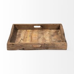 an old wooden tray with handles on a white background