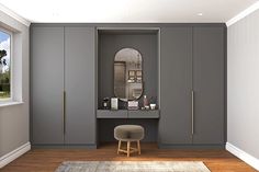 a bathroom with gray cabinets and a mirror on the wall next to a stool in front of a window