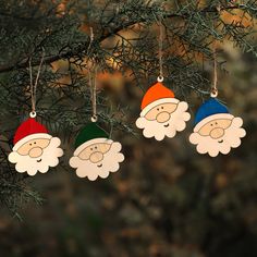 three christmas ornaments hanging from a tree