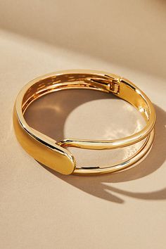 Gold: Gold-plated zinc Silver: Rhodium-plated zinc Hinge closure Imported | Half-Open Bangle Bracelet by Anthropologie in Gold, Women's, Gold/Zinc Formal Metal Bracelet With Spring Ring Clasp, Modern Metal Hinged Jewelry, Modern Metal Bracelets With Clasp, Modern Adjustable Hinged Bracelets, Modern Adjustable Hinged Bracelet, Modern Metal Bracelet With Hinged Closure, Metal Hinged Cuff Bracelet, Adjustable Hinged Metal Cuff Bracelet, Hinged Metal Bracelets