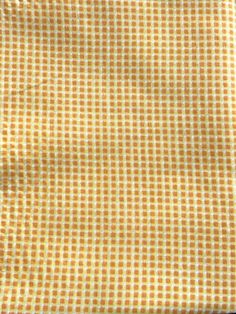 an orange and white checkered cloth on a table