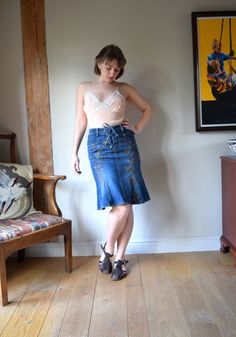 "An amazing vintage Karen Millen denim pencil skirt. Tapestry embroidered sections to the front and a lace-up waist fastening.  Cut to sit tightly, with a kick flare detail at the bottom. Targeted fading design to the hips and back side. Very wearable! The lace-up waist has a back panel for security, but also helps to adjust the size for a perfect fit. In very good vintage condition, with no signs of age or wear. 100% cotton. Marked as a size 10 Waist: from 28\" / 70 up to around 30\"/ 76cm Hips Retro Fitted Denim Skirt For Spring, Fitted Retro Denim Skirt For Spring, Vintage Fitted Skirt For Festival, Vintage Fitted Denim Skirt, Fitted Vintage Denim Skirt, Vintage Fitted Denim Skirt For Summer, Fitted Denim Skirt For Spring Festival, Vintage Fitted Denim Skirt For Spring, Y2k Corset