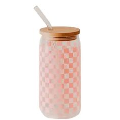 a glass jar with a straw in it