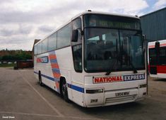 a national express bus parked in a parking lot