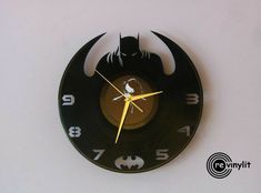 a batman themed clock on the wall