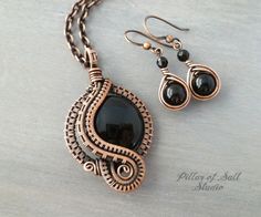 "This woven wire pendant and earring set is handcrafted with copper wire and Black Onyx gemstones. Copper is the traditional gift for the 7th and 22nd wedding anniversary. Onyx is also the gemstone for the seventh anniversary. Metal: solid copper, antiqued. Stone: Black Onyx, opaque black. Dimensions: The pendant is 2\" long by 1 1/8\" wide. The earrings hang 1.5\" from the piercing and are about 3/8\" wide. Chain: solid copper with copper plated lobster clasp. Chain Length: choose from drop-dow Pillar Of Salt, Wire Wrapped Jewelry Pendant, Pendant And Earring Set, Copper Jewelry Handmade, Wire Pendants, Wire Jewellery, Wire Jewelry Designs, Wire Wrap Jewelry, Wire Work Jewelry