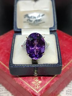 Here we have an incredible statement cocktail ring featuring sparkling natural gemstones with a central very large purple amethyst and diamond assets in a unique art deco inspired design. The ring is fashioned from 9ct yellow gold Birmingham Hallmarked. UK size - O US size - 7.25  Amethyst length approx - 17.9mm Message me any questions  ITEM - S2276 Luxury Formal Amethyst Ring Oval Cabochon, Luxury Classic Amethyst Ring With Prong Setting, Luxury Octagon Amethyst Ring For Anniversary, Luxury Vintage Amethyst Ring For Anniversary, Luxury Purple Crystal Oval Ring, Luxury Elegant Amethyst Ring With Round Band, Amethyst Cocktail Ring, Etsy Gold Ring, Art Deco Inspired