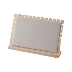 a wooden frame with a white board attached to the front and back of it, on a white background