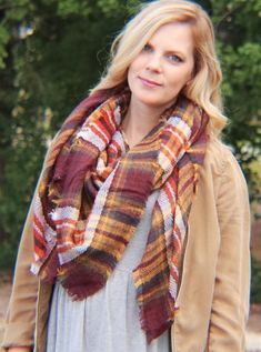 Stay warm and stylish with the plaid blanket scarf in brick. This cozy scarf is both fashionable and practical, making it perfect for any business day or casual weekend. You can even create your own fall street style with this timeless piece. • 100% Acrylic• Plaid scarf Measurements:Width: 140cmLength: 140cm Warm Blankets Cozy, Tree Village, Red Plaid Scarf, Houndstooth Scarf, Diy Fashion Scarf, Cape Scarf, Plaid Blanket Scarf, Scarf Style, Scarf Women Fashion