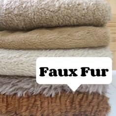 four towels stacked on top of each other with the words faux fur above them