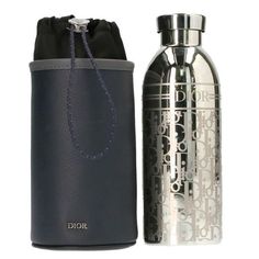 a stainless steel water bottle next to a black leather case with the word jolie written on it